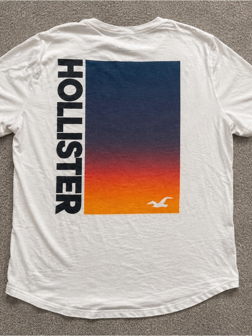 Hollister White Short-Sleeve Tee with Navy-to-Orange Sunset Graphic
